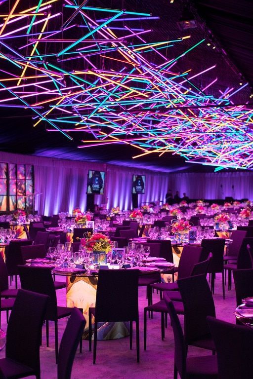 Cool colored lighting on the ceiling at a wedding reception