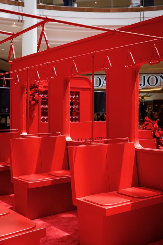 Bright red seating booth installation in a public institution